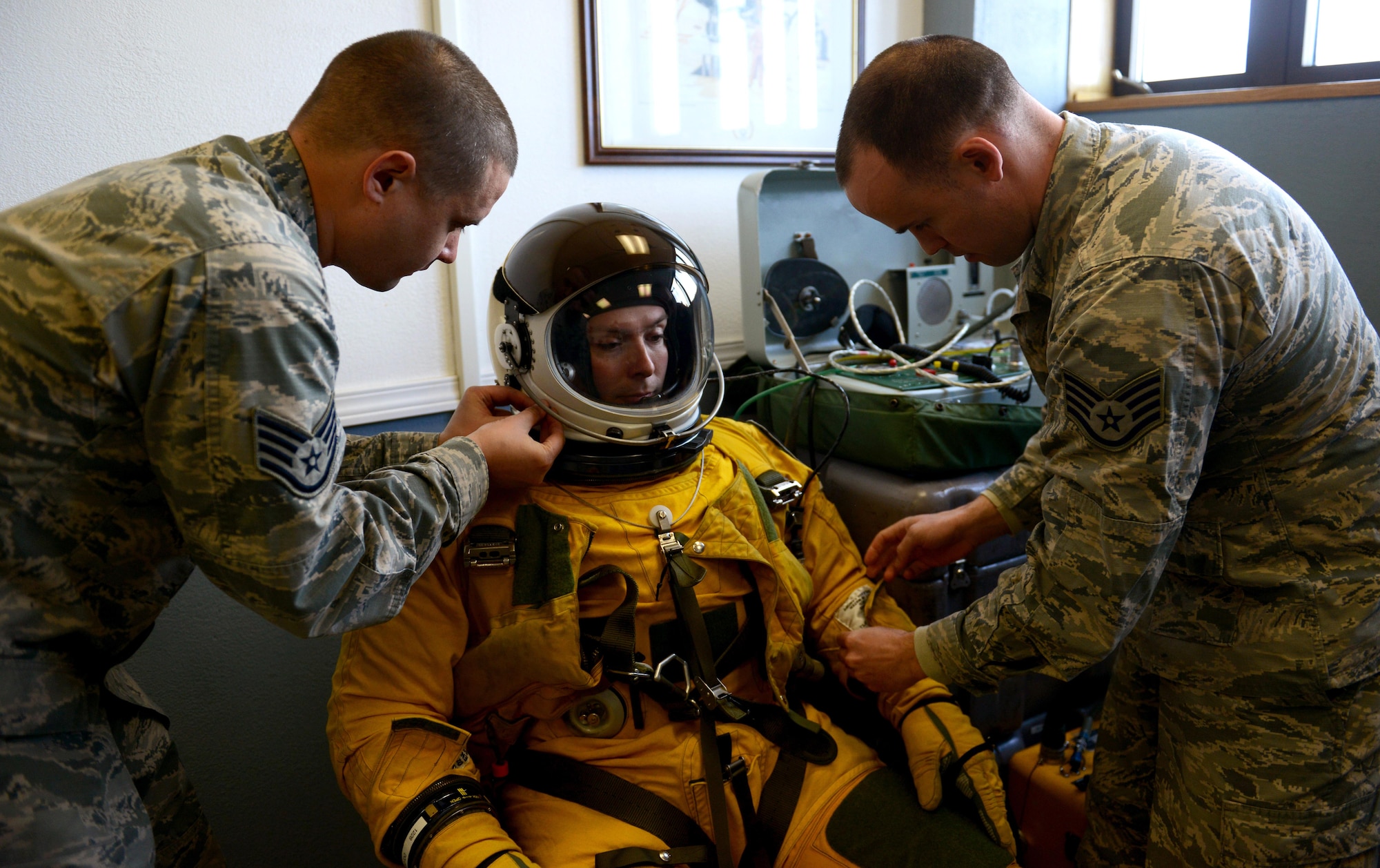 9th Physiological Support Squadron launch and recovery technicians, conduct a pre-flight inspection on a full-pressure suit at Joint Base Elmendorf-Richardson, Alaska, May 8, 2017. The U-2 Dragon Lady participated for the first time in exercise Northern Edge, which is a joint exercise that involves over 200 fixed-wing aircraft. (U.S. Air Force photo/Staff Sgt. Jeffrey Schultze)