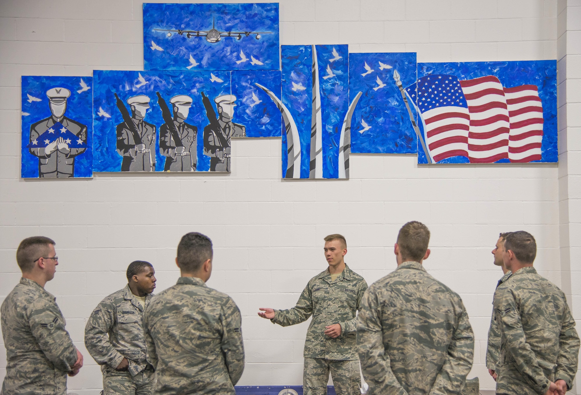 Senior Airman Andrew Zander, Air Force Honor Guard, explains basic pall bearer procedures with the Scott Air Force Base Honor Guard, May 9, 2017. The Air Force Honor Guard conducts training at multiple bases a year to make sure the standard is maintained Air Force wide. (U.S. Air Force photo by Airman 1st Class Daniel Garcia)