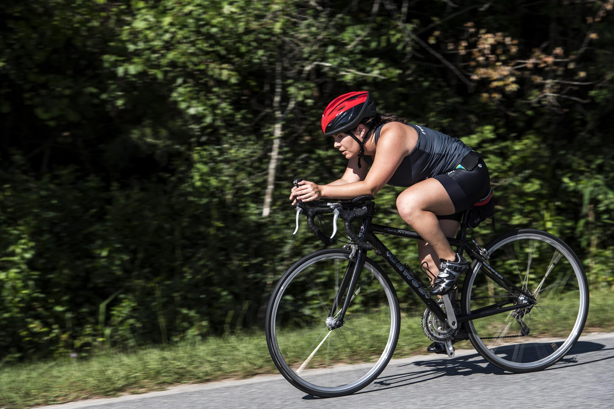 A competitor coasts through the bike portion of the Police Week Quadathalon, May 15, 2017, at Moody Air Force Base, Ga. Teams of four participated in a swim, run, bike and ruck march competition, where the team with the fastest time won bragging rights. Overall, Police Week is designed to honor the legacies fallen officers, both civilian and military, have left behind, but it also gives various sections within the law enforcement community an opportunity to train together in friendly competitions. (U.S. Air Force photo by Senior Airman Janiqua P. Robinson)