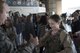 Staff Sgt. Bo Hall, 434th Security Forces Squadron fire team member, demonstrates proper handling of riot gear to a student at Grissom Air Reserve Base, Ind., May 15, 2017. Students from multiple schools visited Grissom for the 22nd annual Police Day, where they participated in activities with local and federal law enforcement officers. (U.S. Air Force photo/Senior Airman Harrison Withrow)
