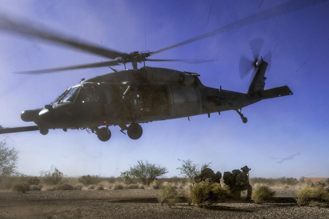 An HH-60 Pave Hawk drops off pararescuemen during a personnel recovery scenario as part of Angel Thunder 17 in Gila Bend, Ariz., May 13, 2017. Angel Thunder is a two-week, Air Combat Command-sponsored exercise focused on search and rescue capabilities. Air Force photo by Staff Sgt. Marianique Santos