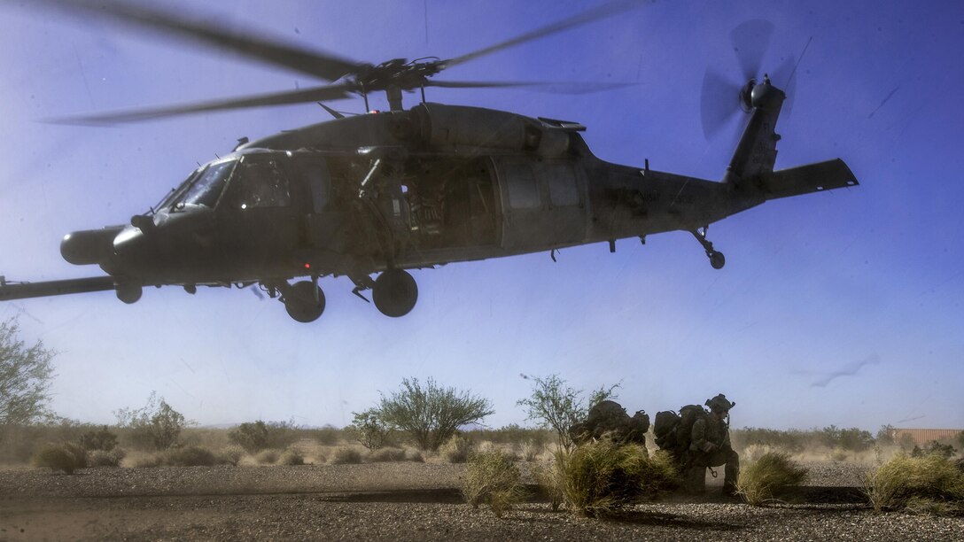 An HH-60 Pave Hawk drops off pararescuemen during a personnel recovery scenario as part of Angel Thunder 17 in Gila Bend, Ariz., May 13, 2017. Angel Thunder is a two-week, Air Combat Command-sponsored exercise focused on search and rescue capabilities. Air Force photo by Staff Sgt. Marianique Santos