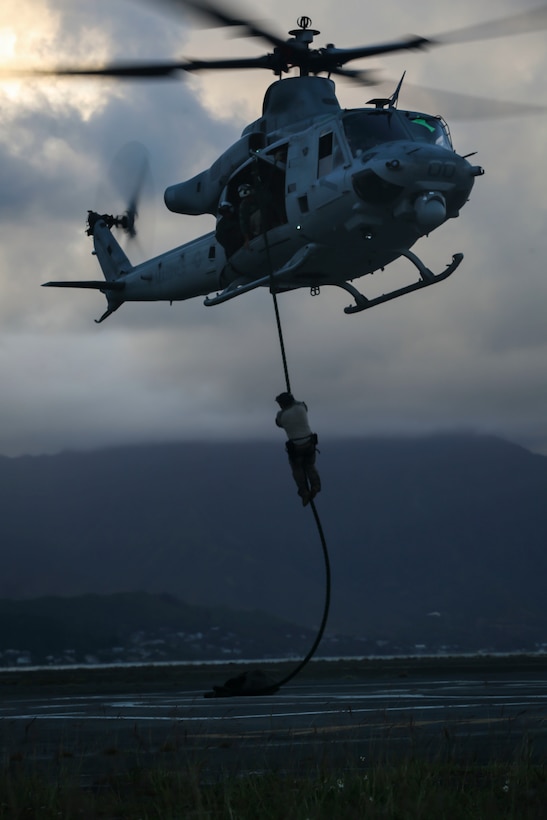 A U.S. Marine Corps UH-1Y Huey assigned to Marine Light Attack Helicopter Squadron 367 hovers over the ground at Landing Zone Westfield during a joint training exercise aboard Marine Corps Air Station Kaneohe Bay on May 10, 2017. The mission of HMLA-367 is to support the Marine Air-Ground Task Force commander by providing offensive air support, armed escort and airborne supporting arms coordination, day or night, under all weather conditions during expeditionary, joint, or combined operations. (U.S. Marine Corps photo by Cpl. Zachary Orr)