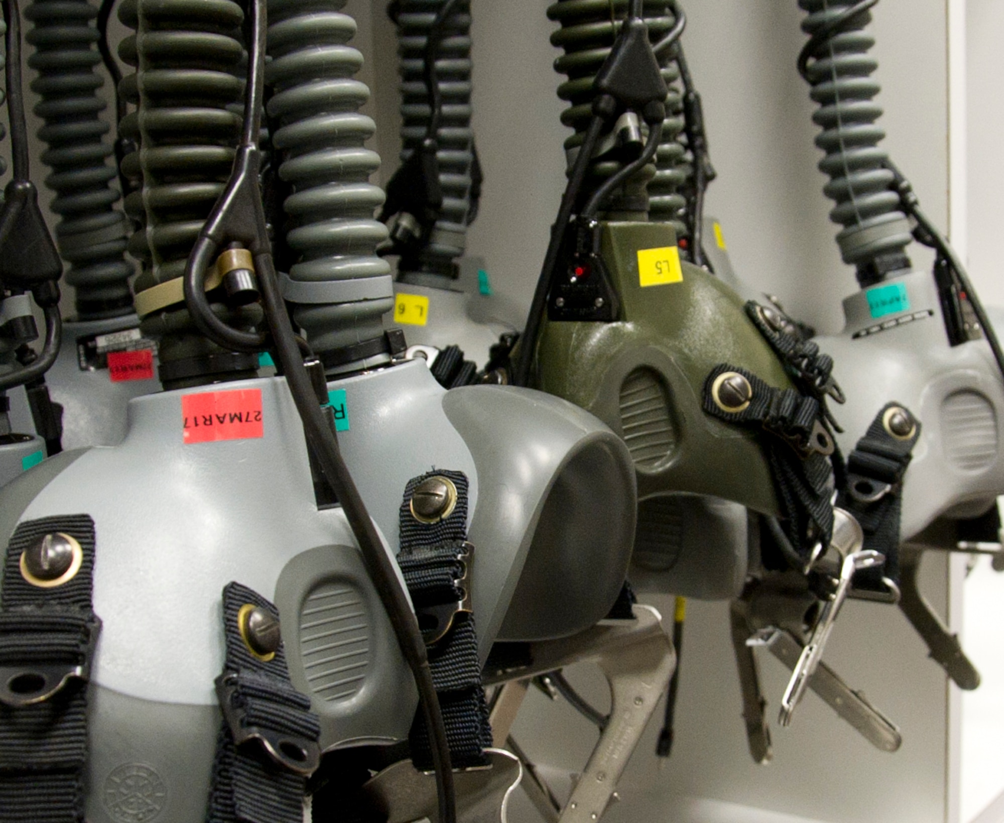 Oxygen Mask Breathing Units-5/P are stored on hooks when not being used by students undergoing altitude training at the 779th Aerospace Medical Squadron chamber facility at Joint Base Andrews, Md. Students are typically military or civilian personnel who perform their jobs in flying aircraft, like pilots, flight engineers, boom operators, load masters, flight attendants and aerial photographers. (U.S. Air Force photo by Staff Sgt. Joe Yanik)