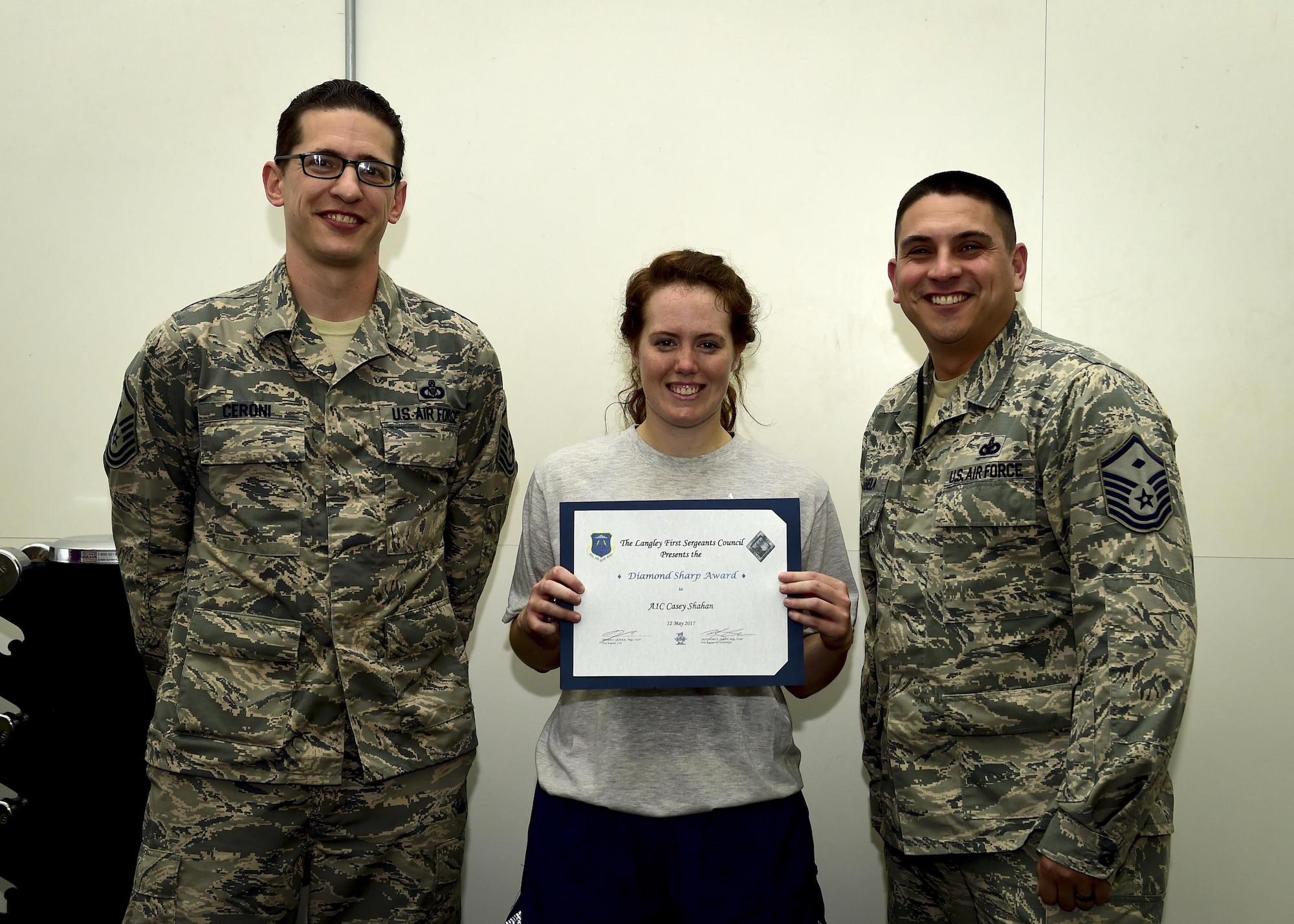 U.S. Airman 1st Class Casey Shahan, 633rd Air Base Wing Legal Office military justice paralegal, accepts the Diamond Sharp Award from first sergeants, at Joint Base Langley Eustis, Va., May 12, 2017. The Diamond Sharp Award is presented to Airmen who excel in all areas of their job performance and personal appearance. (U.S. Air Force photo/Staff Sgt. Areca T. Bell)  