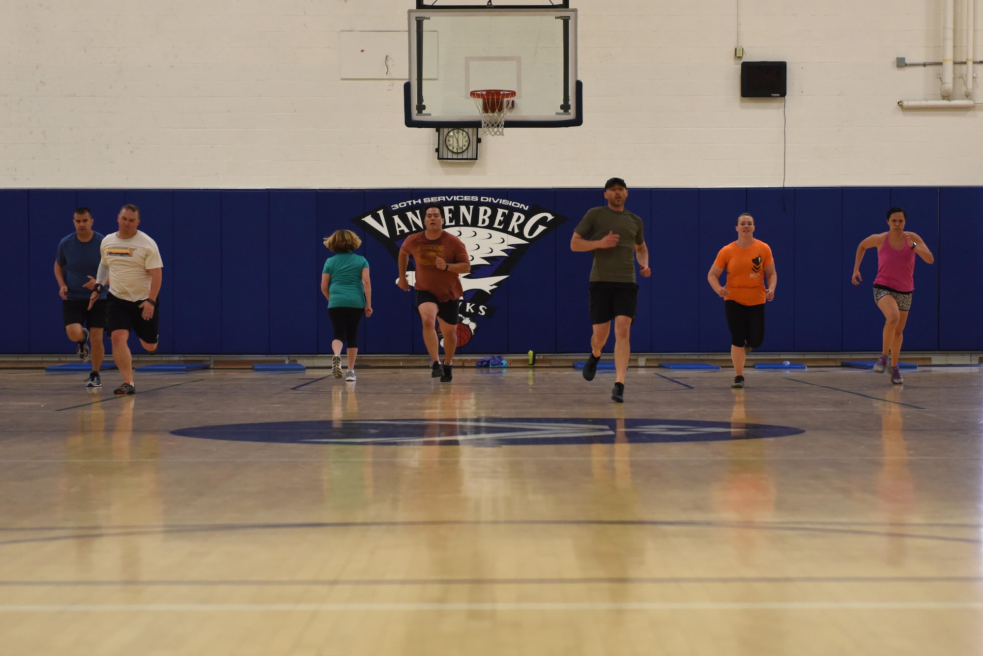 Team V members perform exercise drills called suicides during a functional fitness class, May 15, 2017, Vandenberg Air Force Base, Calif. Physical Fitness Month encourages a renewed commitment to a healthy, active lifestyle. (U.S. Air Force photo by Senior Airman Robert J. Volio/Released)