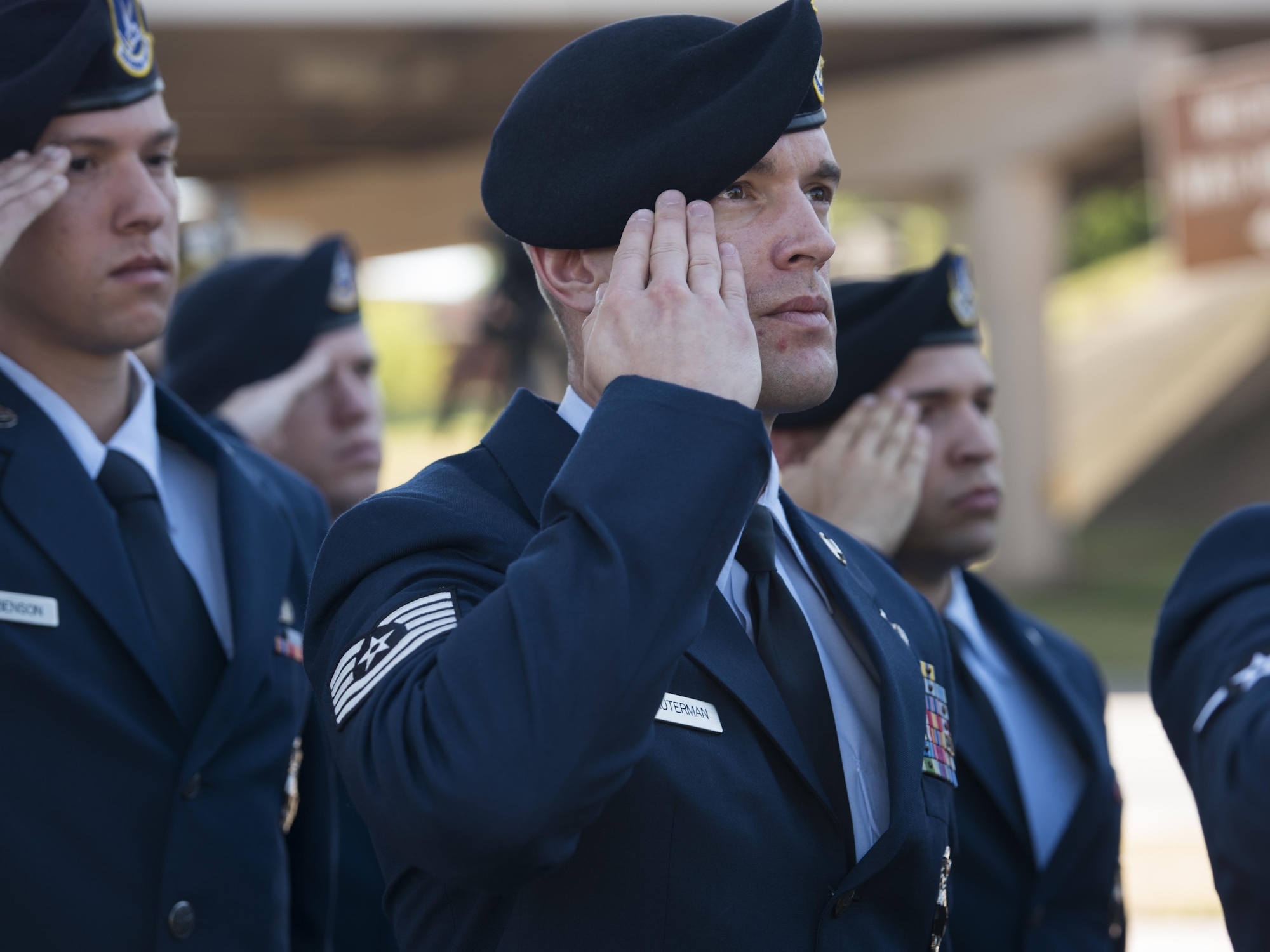 Tech. Sgt. Jered Dauterman, 82nd Security Forces Squadron NCO in charge of training, salutes the U.S. flag as it rises to half-staff during the National Police Week proclamation ceremony, May 15, 2017. National Police Week honors both current and former law enforcement officers as well as officers who’ve paid the ultimate sacrifice. (U.S. Air Force photo by Staff Sgt. Kyle E. Gese)