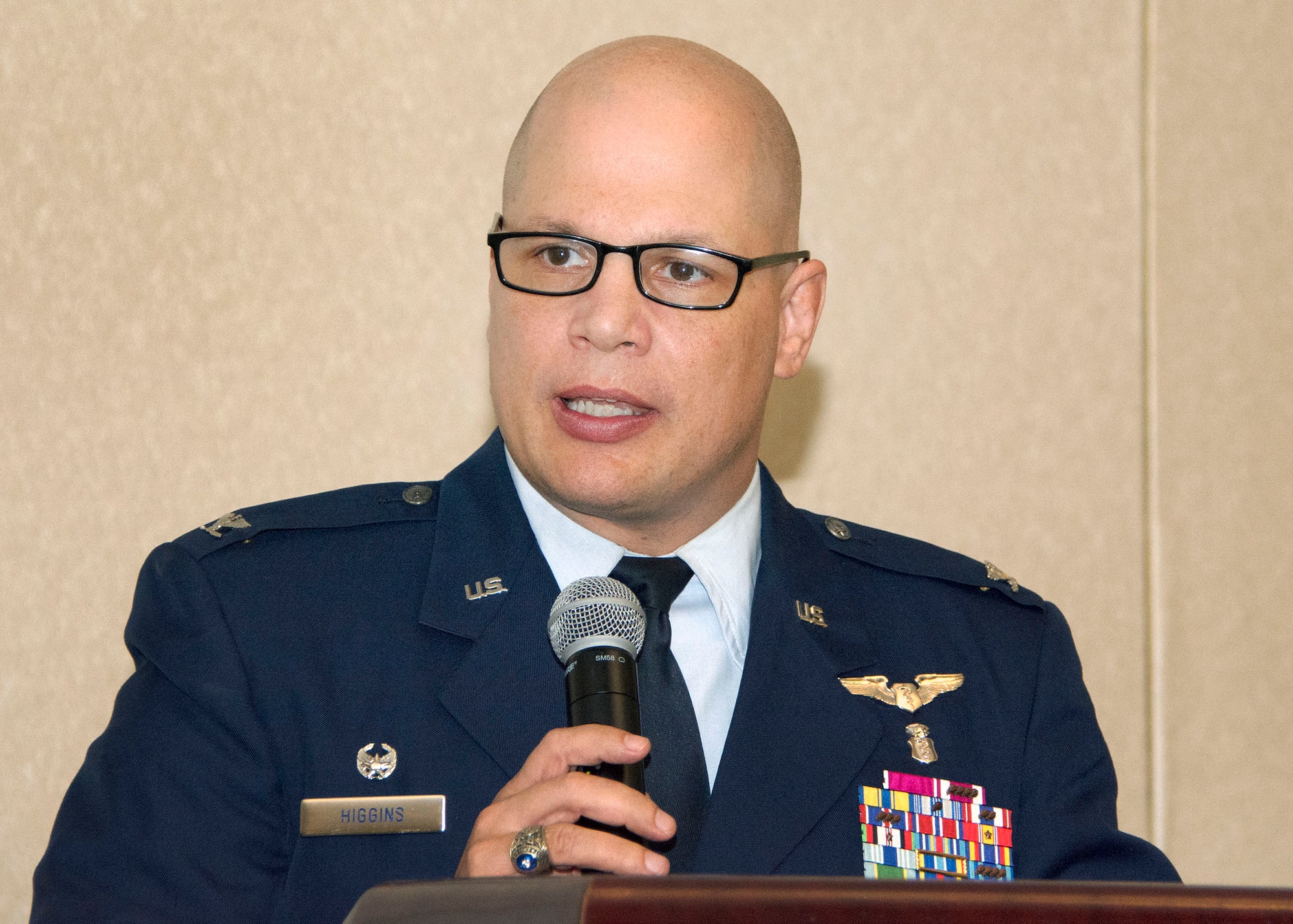 Col. (Dr.) Michael Higgins, 60th Medical Group commander, addresses the audience at the annual Volunteers Luncheon at Travis Air Force Base, Calif., April 28, 2017. In 2016, Airmen and their families contributed thousands of hours volunteering at Travis and in the local community. (U.S. Air Force  photo/T.C. Perkins Jr.)
