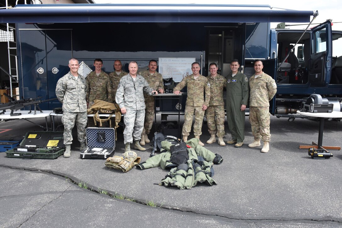 Colorado Air National Guard 140th Wing senior leaders and members of the Explosives Ordnance Disposal Flight, pose for a photo during training May 7, 2017. Two days later, seven team members responded to a severe car accident outside of the Buckley Air Force Base, Colo., perimeter to provide emergency care to an unconscious individual and directed traffic to facilitate access for Aurora Fire and Ambulatory services. (U.S. Air National Guard photo by Staff Sgt. Michelle Y. Alvarez-Rea) 