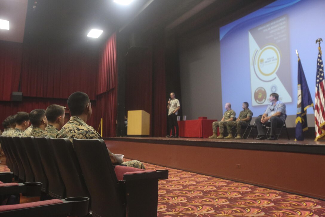 Marines in the Solar Ready Vets course listen as Steve Auerbach, a course instructor, speaks during their graduation ceremony at the theater aboard Marine Corps Base Hawaii on May 11, 2017. The six-week course provided the Marines with basic knowledge of photovoltaic systems and prepared them for the North American Board of Certified Energy Practitioners PV Associates exam. Upon completion of the exam, the Marines will be qualified for solar energy related occupations. (U.S. Marine Corps photo by Lance Cpl. Matthew Kirk)