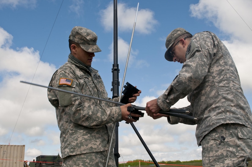 Pfc. Ismael Torres, a cable system installer maintainer, left, and Spc. Cody Gomez, a microwave system operator maintainer, assemble a transmission antenna during Exercise Maple Resolve 17 at Camp Wainwright, Alberta, May 16, 2017. Torres and Gomez, both California natives, belong to the 306th Psychological Operations Company. Exercise Maple Resolve is an annual collective training event designed for any contigency operation. Approximately 4,000 Canadian and 1,000 U.S. troops are participating in Exercise Maple Resolve 17.