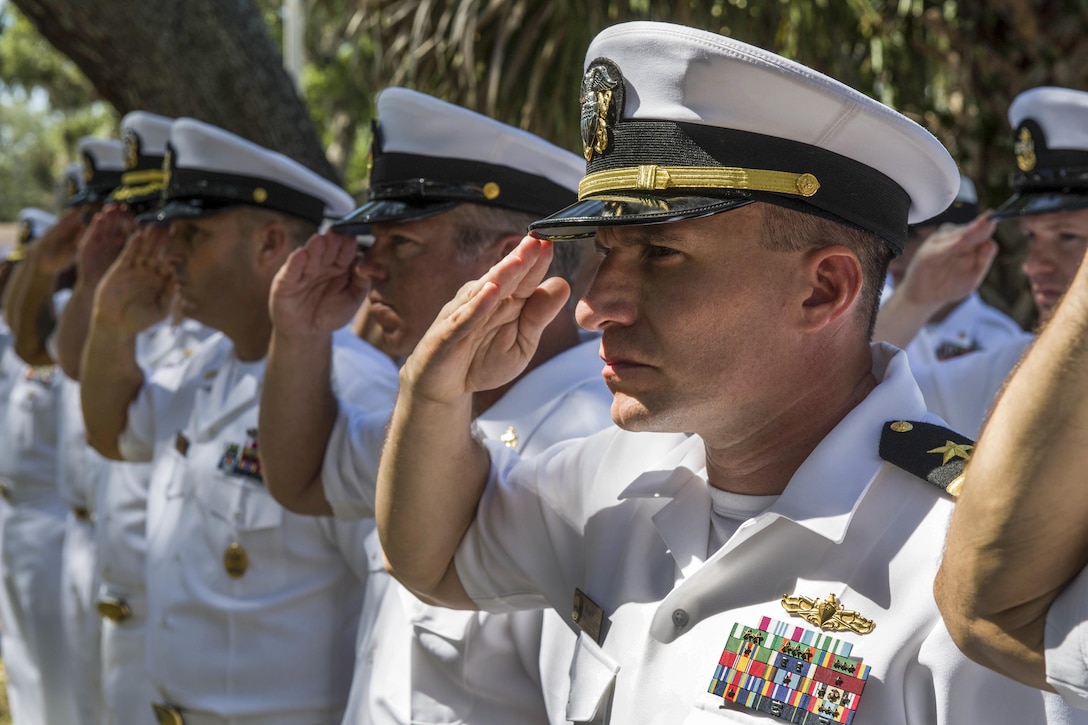 Sailors salute as taps is played during a remembrance ceremony for the guided-missile frigate USS Stark at Naval Station Mayport, Fla., May 17, 2017. Iraqi missiles struck the frigate in 1987, killing 37 sailors. Navy photo by Petty Officer 3rd Class Michael Lopez