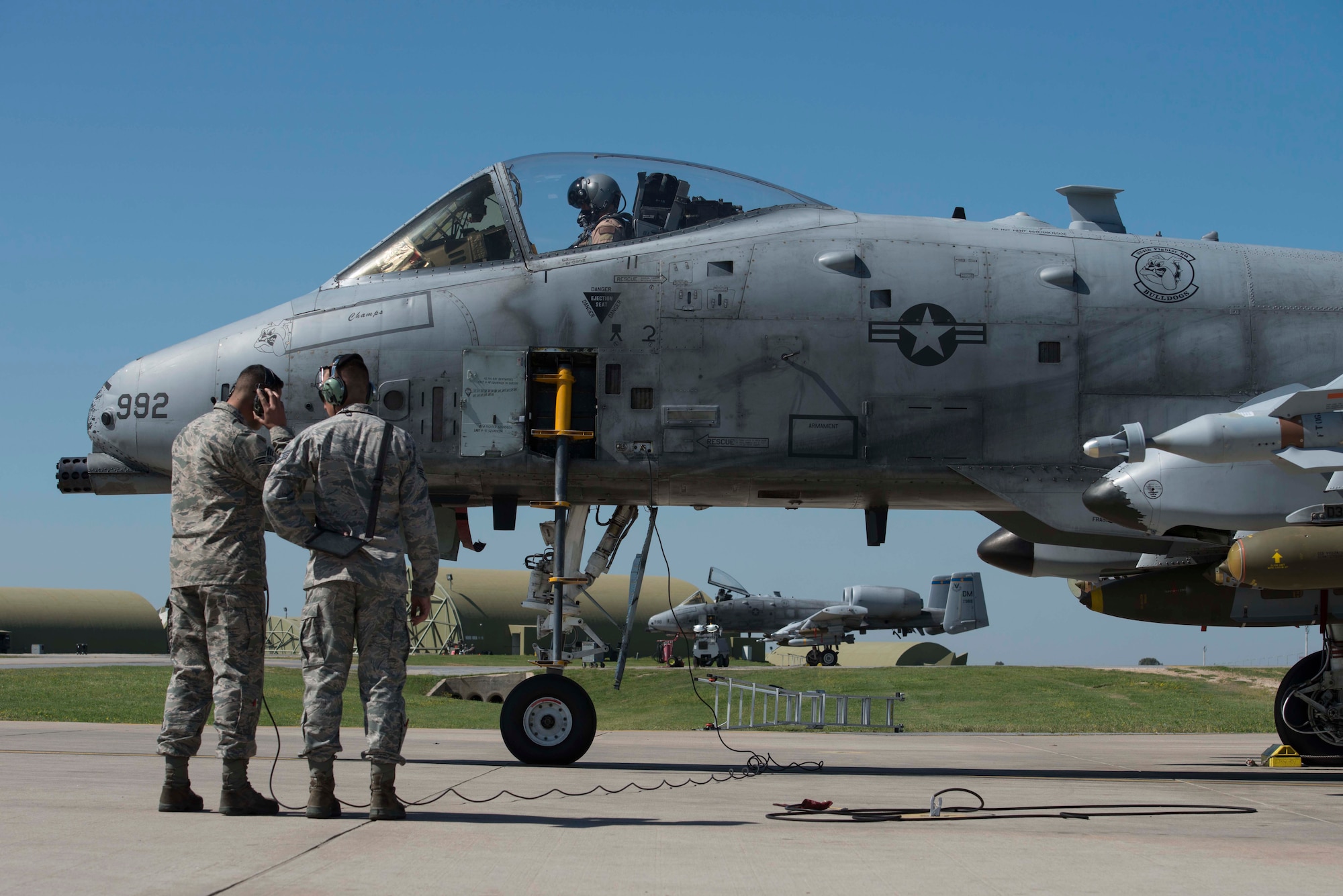 U.S. Senior Airman Justin Macken (left), and Staff Sgt. Alex Albrecht, crew chiefs with the 447th Expeditionary Aircraft Maintenance Squadron, speak with the A-10 Thunderbolt II pilot during a pre-flight check April 5, 2017, at Incirlik Air Base, Turkey, in support of Operation INHERENT RESOLVE. Pre-flight checks are accomplished to ensure the aircraft is prepared for flight. (U.S. Air Force photo by Airman 1st Class Devin M. Rumbaugh)