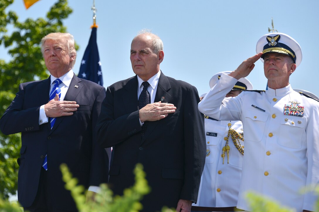 President Donald Trump, Secretary of Homeland Security John F. Kelly, center, and Coast Guard Commandant Adm. Paul Zukunft render honors during the 136th U.S. Coast Guard Academy commencement in New London, Conn., May 17, 2017. Coast Guard photo by Petty Officer 2nd Class Patrick Kelley 



