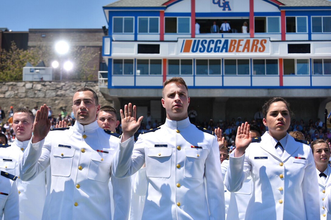 The newest ensigns in the Coast Guard take the oath of office during the 136th Coast Guard Academy commencement in New London, Conn., May 17, 2017. Coast Guard photo by Petty Officer 2nd Class Patrick Kelley