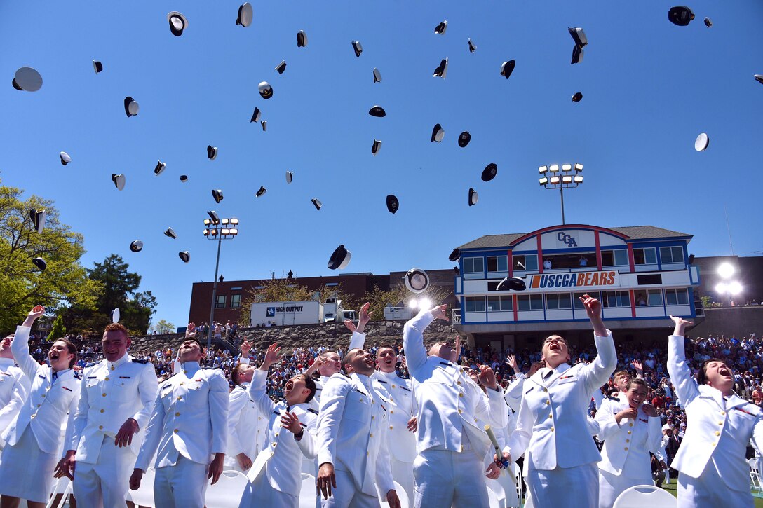 Graduates from the U.S. Coast Guard Academy celebrate by tossing their hats into the air during graduation and commissioning ceremonies at the 136th Coast Guard Academy commencement in New London, Conn., May 17, 2017. Coast Guard photo by Petty Officer 2nd Class Patrick Kelley 