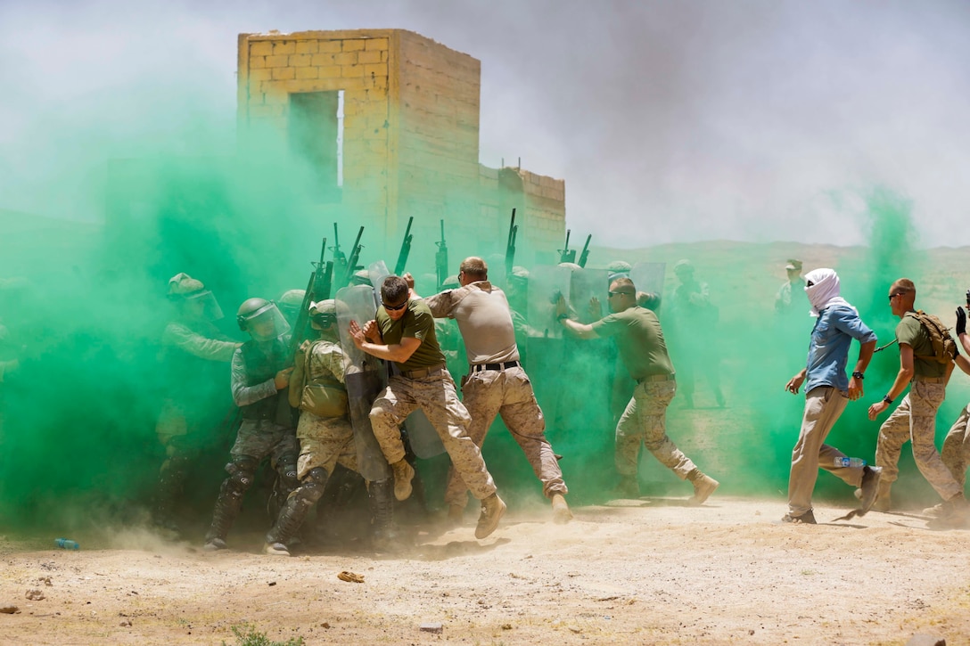 U.S. Marines with Military Police Company Alpha, 4th Law Enforcement Battalion, and the Jordanian 77th Marine Battalion, participate in a Non-Lethal Weapons and Tactics Course during Eager Lion 17, May 11, 2017. Eager Lion is an annual U.S. Central Command exercise in Jordan designed to strengthen military-to-military relationships between the U.S., Jordan and other international partners. This year's iteration is comprised of about 7,400 military personnel from more than 20 nations that will respond to scenarios involving border security, command and control, cyber defense and battlespace management.  (U.S. Marine Corps photo by Staff Sgt. Vitaliy Rusavskiy)