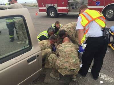 Seven members of the Colorado Air National Guard 140th Wing Explosives Ordnance Disposal Flight responded to a severe car accident May 9, 2017, outside of the Buckley Air Force Base perimeter in Aurora, Colo. The Airmen provided emergency care to an unconscious individual and directed traffic to facilitate access for Aurora Fire and Ambulatory services. 