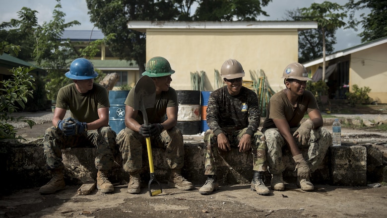 Philippine Army and U.S. Marine engineers take a break during an engineering civic assistance project in support of Balikatan 2017 in Ormoc City, Leyte, May 14, 2017. Philippine and U.S. service members worked together to build new classrooms for students at Don Carlos Elementary School. Balikatan is an annual U.S.-Philippine bilateral military exercise focused on a variety of missions, including humanitarian assistance and disaster relief, counterterrorism, and other combined military operations.