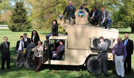 DAHLGREN, Va. - The Ground Based Air Defense on the Move Team is pictured prior to receiving the Award of Merit for Group Achievement from Naval Surface Warfare Center Dahlgren Division (NSWCDD) leadership at the command's annual honor awards ceremony on May 17, 2017. The team was recognized for their significant progress towards the deployment of a High Energy Laser system to the USMC. "The recent end-to-end negation of threat representative unmanned aircraft system at the White Sands Missile Range High Energy Laser System Test Facility is a significant event culminating five years of work on this Office of Naval Research sponsored Future Naval Capability," according to the citation. The team members are Frank Albert, Jonathan Curley, Koleanna Hart, Matthew Henning, Jorge Hernandez, Jonathan Scroggins, Cassandra Staples, Justin Webber, Eric Wheater, Lin Zheng, Christopher Davidson, Michael Lent, Mark Manzano, Aaron Banerjee, Rani Kady, Jason Goosman, and Austin Pritchett.