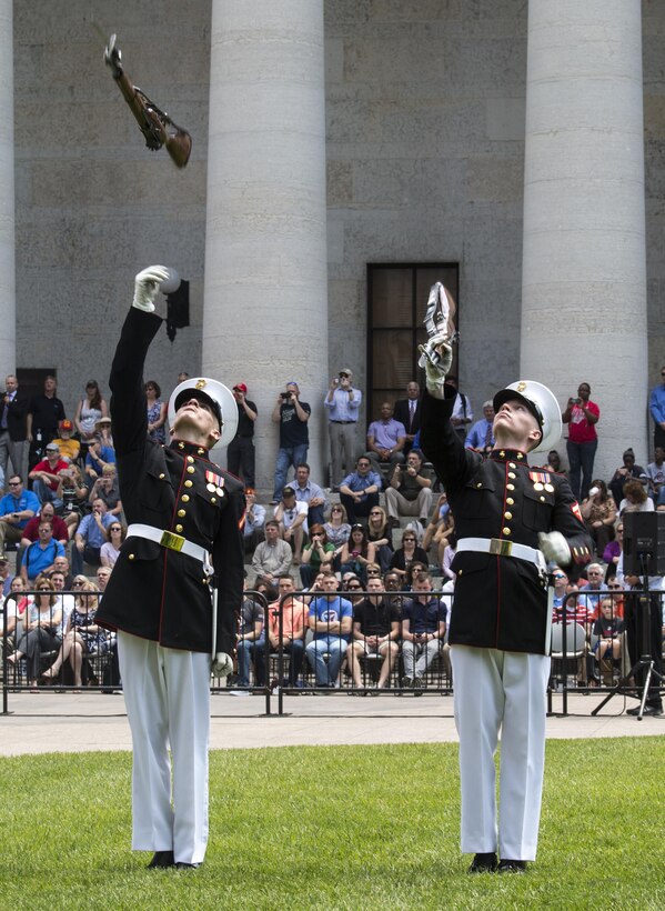 The U.S. Marine Corps Silent Drill Platoon executes precision drill maneuvers during a Battle Color Ceremony at the Ohio Statehouse, Columbus, Ohio, May 16, 2017. The Marine Corps Battle Color Detachment was invited and hosted by the Speaker of the Ohio House of Representatives, Clifford A. Rosenberger, to tour the Statehouse and perform for members of the House of Representatives and the city of Columbus. In December, the Barracks provided Marines in supporting the public viewing of former Marine, Senator and astronaut, John Glenn, at the Statehouse. In attendance at the Battle Color Ceremony was Glenn’s widow, Annie Glenn, to show her continued support of the beloved Corps. (Official Marine Corps photo by Cpl. Robert Knapp/Released)