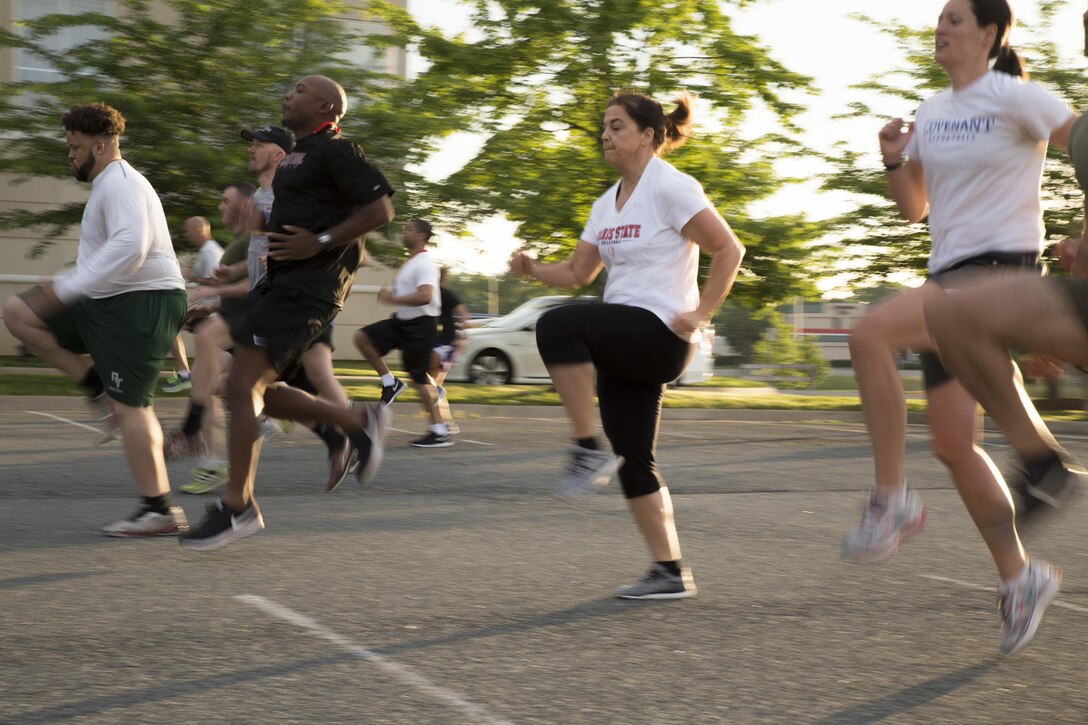 Tia Brandal and 34 other collegiate coaches from across the United States conduct warm-up exercises at a Holiday Inn Express during the Marine Corps’ 2017 Coaches Workshop in Dumfries, Va., May 18. Throughout the workshop coaches will learn how to patrol, execute Marine Corps Martial Art techniques, learn about the Marine Corps’ officer programs and experience several different events. The workshop develops mutually beneficial relationships between collegiate influencers and the Marine Corps where coaches can share knowledge about the Marines to their athletes based on first-hand experiences. Brandal is a volleyball for Ferris State University in Big Rapids, Michigan.