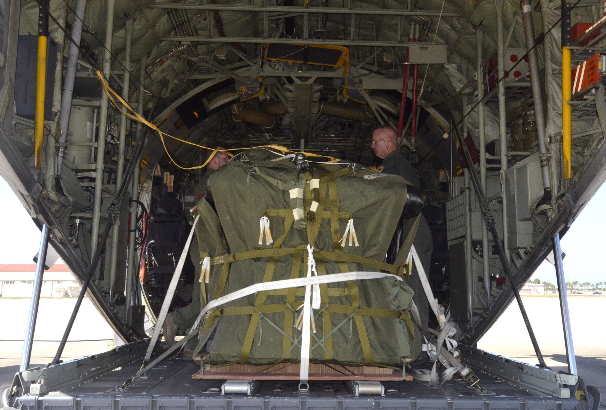 Citizen Airmen with the 920th Rescue Wing secure a pallet of search and rescue equipment inside an HC-130 King aircraft May 16 at Patrick Air Force Base, Florida, in preparation for a mission off the coast of the Bahamas to search for a downed aircraft and four passengers. (U.S. Air Force photo/Senior Airman Brandon Kalloo)

