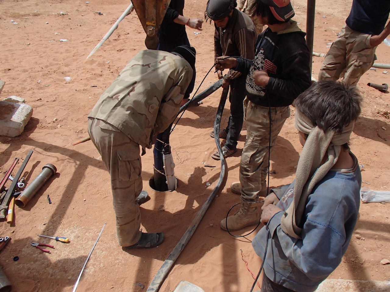 Members of Maghawir al-Thawra work to repair a water well in At Tanf Garrison in southern Syria for partner forces fighting the Islamic State of Iraq and Syria and local residents in the area. The water well is capable of supplying more than 317,000 gallons of water daily. Army photo