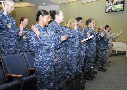 Nurses and medical technicians recite the Florence Nightingale Pledge during the closing ceremony for National Nurses Week at the Medical Education and Training Campus at Joint Base San Antonio-Fort Sam Houston May 11. Navy and Air Force nurses and medical technicians participated together in several health promotions activities throughout the week to commemorate Nurses Week.