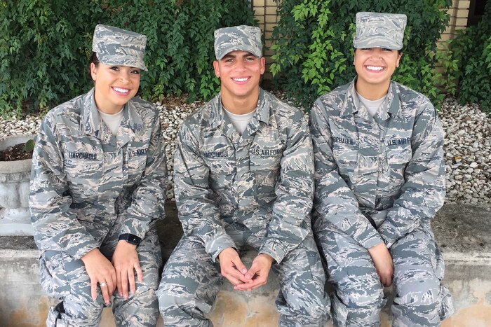 The Harchaoui triplets -- from left, Myriam, a 436th Supply Chain Operations Squadron at Scott Air Force Base, Ill.; Rabah, assigned to the 56th Security Forces Squadron at Luke Air Force Base, Ariz.; and Warda, with the 60th Medical Operations Squadron at Travis Air Force Base, Calif. -- were born in Algeria before moving to the United States. Courtesy photo