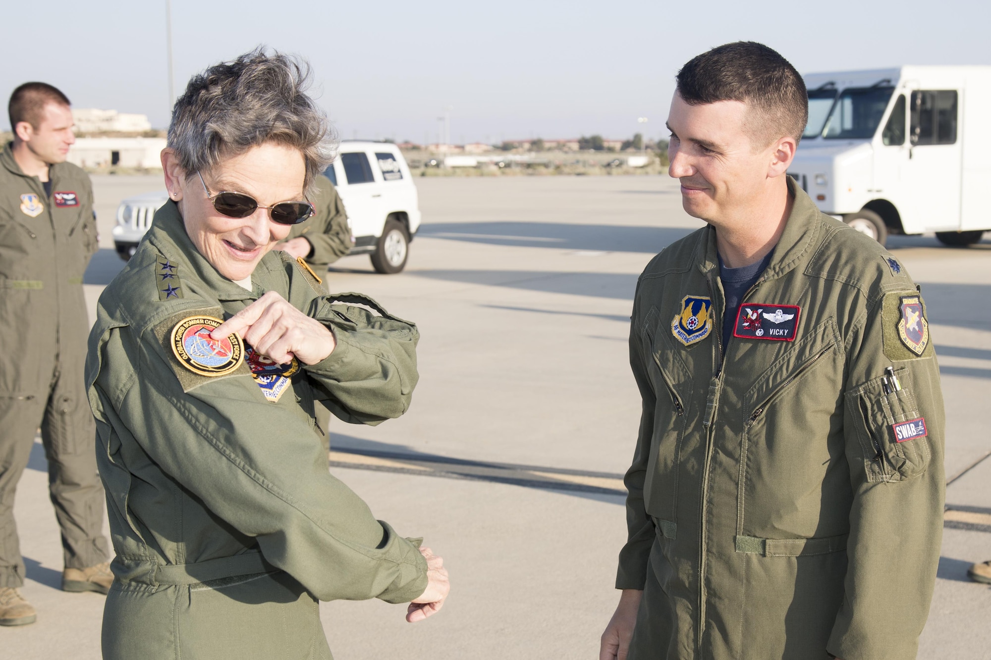 Gen. Ellen Pawlikowski, commander of Air Force Materiel Command, puts on a Global Power Bomber Combined Test Force patch provided by Lt. Col. Miles Middleton, 419th Flight Test Squadron commander and GPBCTF director. AFMC is the major Air Force command of which Edwards Air Force Base falls under. (U.S. Air Force photo by Christian Turner)