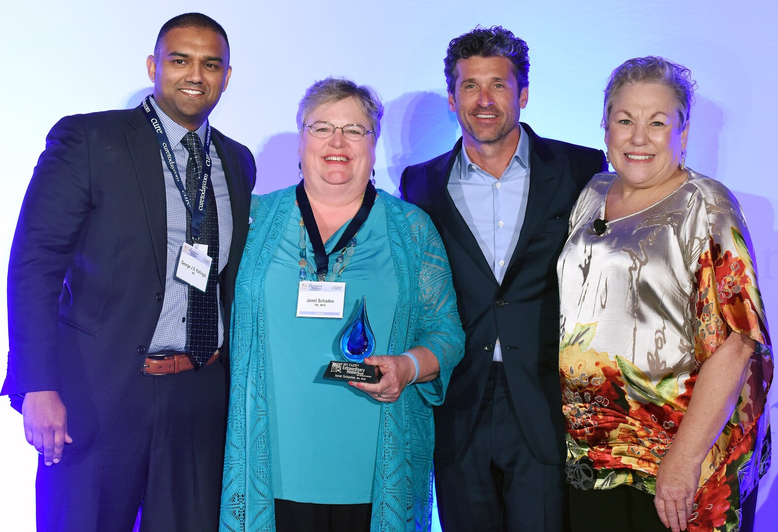 (From left) Army Maj. (Dr.) George J.S. Kallingal, Janet Schadee, actor Patrick Dempsey and Sara Sargente pose for a photo during the CURE Magazine 2017 Extraordinary Healer Award ceremony in Denver, Colo., May 4.