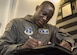 Tech. Sgt. Anthony Montgomery, 201st Airlift Squadron flight attendant, takes pre-flight notes before a Mission Readiness Airlift at Joint Base Andrews, Md., March 31, 2017. The 201st AS supports a flying schedule consisting of approximately five large trips a month that range from five to 12 days and go almost anywhere around the world. (U.S. Air Force photo by Senior Airman Jordyn Fetter)