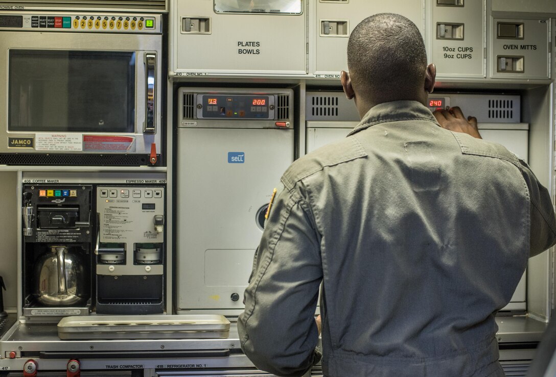 Tech. Sgt. Anthony Montgomery, 201st Airlift Squadron flight attendant, prepares the flight kitchen before a Mission Readiness Airlift at Joint Base Andrews, Md., March 31, 2017. The 201st AS and their three C-40 Clippers are tasked with congressional transports and Mission Readiness Airlifts through the Office of the Secretary of Defense and Vice Chief of Staff of the Air Force. (U.S. Air Force photo by Senior Airman Jordyn Fetter)
