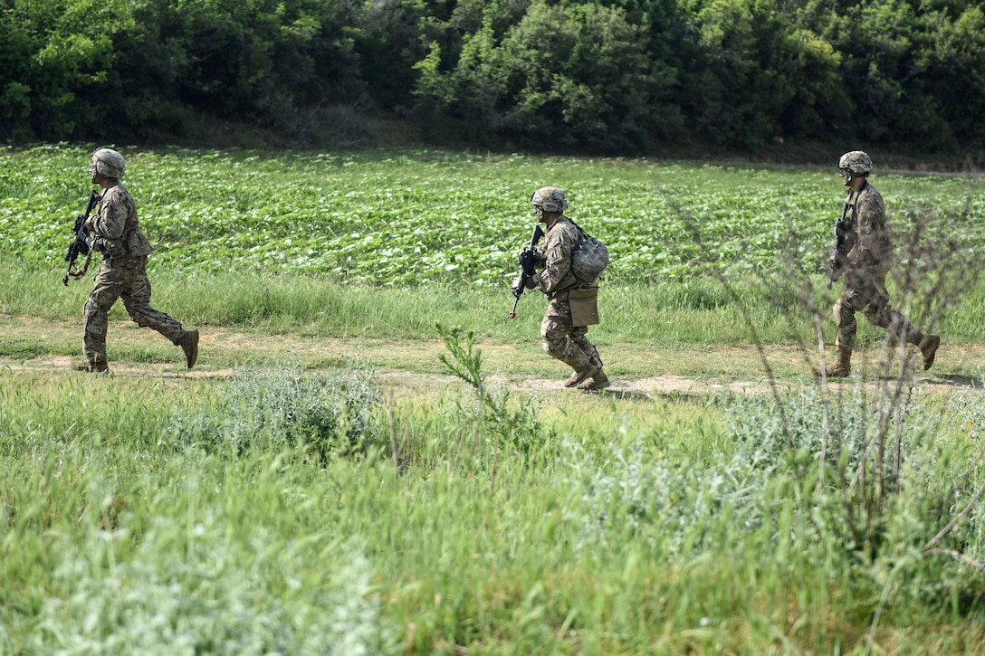 U.S. soldiers rush to their next objective during a raid on an enemy campsite, as a part of Exercise Bayonet Minotaur in Thessaloniki, Greece, May 17, 2017. Army photo by Staff Sgt. Philip Steiner    