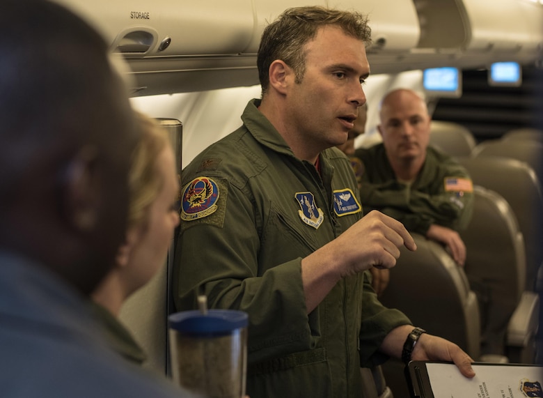 Maj. Greg Zickefoose, 201st Airlift Squadron assistant director of operations, gives a pre-flight briefing before a Mission Readiness Airlift at Joint Base Andrews, Md., March 31, 2017. The squadron conducts Mission Readiness Airlifts, which are authorized by the National Guard Bureau for personnel and cargo requiring transportation to meet training requirements. They also provide aircrews with practical experience involving transporting loads, unfamiliar operating locations and other qualification requirements. (U.S. Air Force photo by Senior Airman Jordyn Fetter)