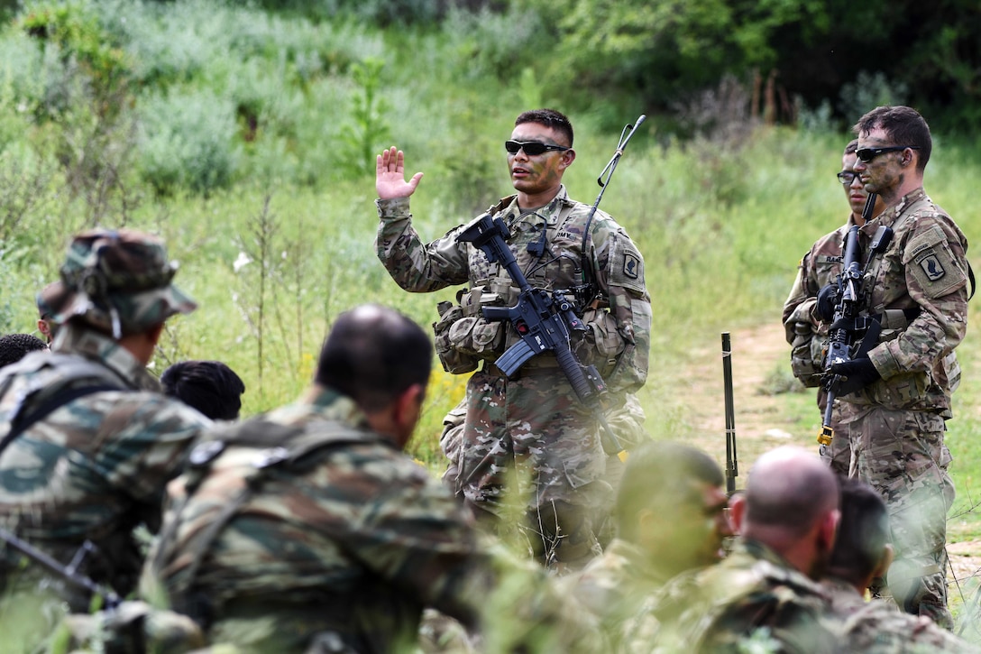 A U.S. soldier gives an after-action review to U.S. and Greek soldiers after a raid on an enemy campsite, as a part of Exercise Bayonet Minotaur in Thessaloniki, Greece, May 17, 2017. Army photo by Staff Sgt. Philip Steiner