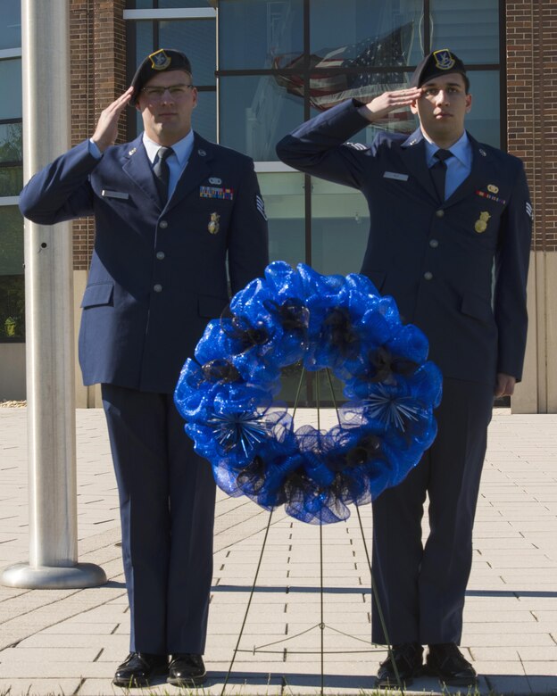 Security Forces members salute during the 2017 National Police Week Wreath Laying Ceremony at Joint Base Andrews, Md., May 15, 2017. The ceremony kicked off JBA’s events for police week, which are meant to honor past and present police officers and security forces members. (U.S. Air Force photo by Airman 1st Class Valentina Lopez)
