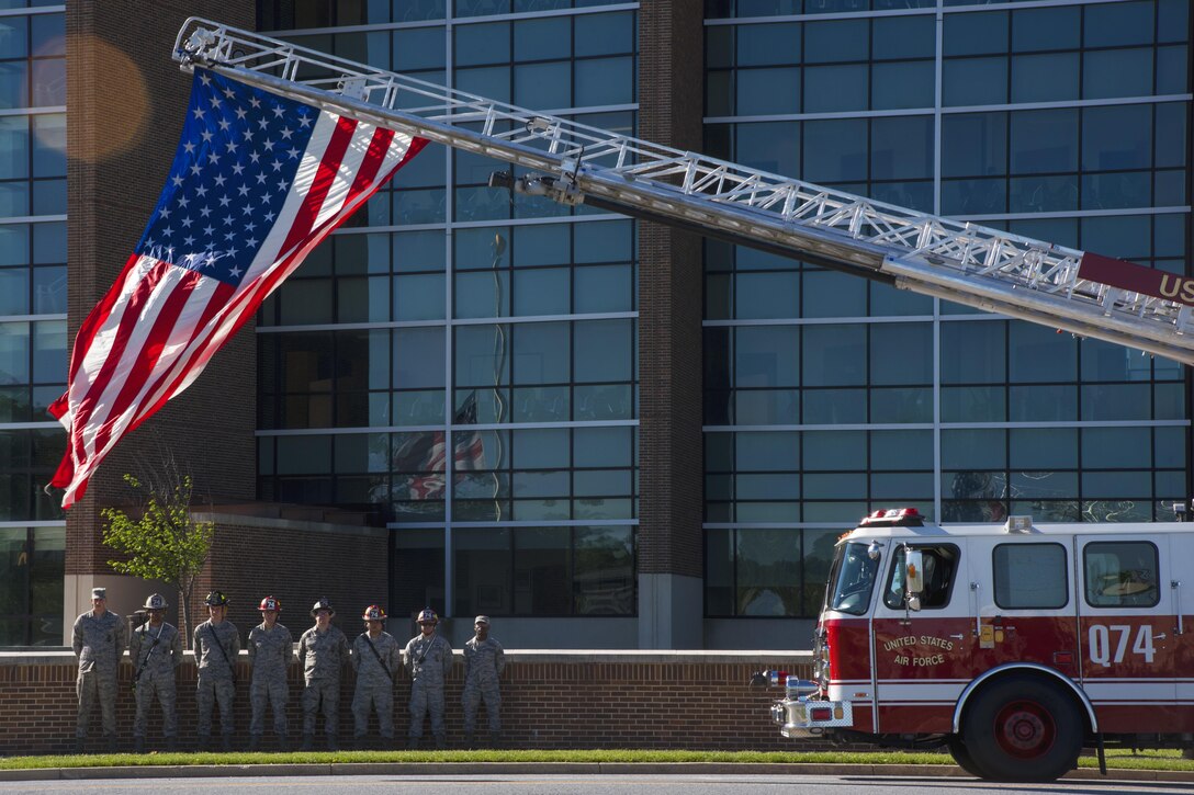 Firefighters stand at ease during the 2017 National Police Week Wreath Laying Ceremony at Joint Base Andrews, Md., May 15, 2017. National Police Week is meant to remember the fallen and honor those who serve as police officers or security forces members. (U.S. Air Force photo by Airman 1st Class Valentina Lopez)