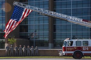 Firefighters stand at ease during the 2017 National Police Week Wreath Laying Ceremony at Joint Base Andrews, Md., May 15, 2017. National Police Week is meant to remember the fallen and honor those who serve as police officers or security forces members. (U.S. Air Force photo by Airman 1st Class Valentina Lopez)