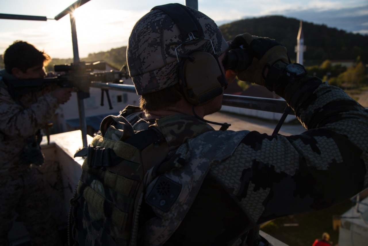 A Naval Special Warfare team surveys an enemy target during Exercise Saber Guardian 17 at the Joint Multinational Readiness Center at Hohenfels, Germany, May 1, 2017. Exercise Saber Junction 17 is a U.S. Army Europe-directed exercise designed to assess the readiness of the Army's 2nd Cavalry Regiment to conduct unified land operations alongside NATO allies and partners. Army photo by Spc. Gage Hull