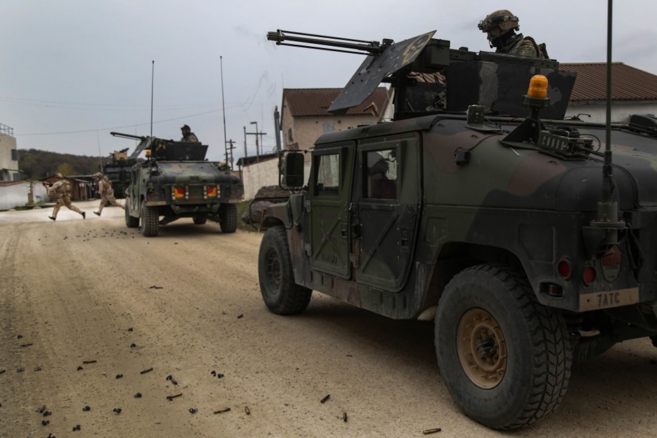 Naval Special Warfare operators from Special Operations Command engage in a tactical maneuver during Exercise Saber Junction 17 at the Joint Multinational Readiness Center at Hohenfels, Germany, May 1, 2017. Exercise Saber Junction 17 is a U.S. Army Europe-directed exercise designed to assess the readiness of the Army's 2nd Cavalry Regiment to conduct unified land operations alongside NATO allies and partners. Army photo by Spc. Gage Hull