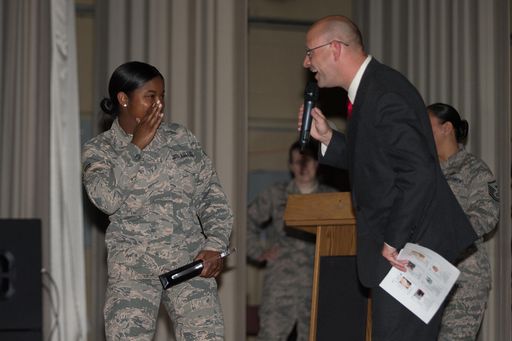 Airman 1st Class Latoya Person, 412th Maintenance Group, gets to play a game like on “The Price is Right” game show at the 412th Test Wing First Quarter Award Ceremony May 16 at the base theater.  The game show host was Senior Master Sgt. Deshan Woods, 412th Security Forces Squadron. (U.S. Air Force photo by Don Allen)
