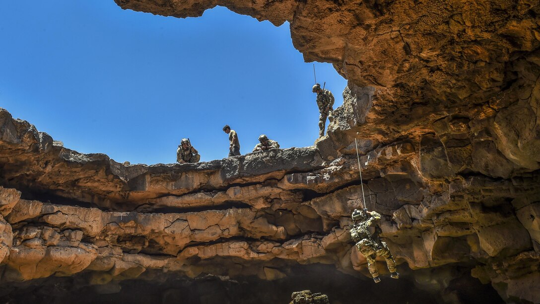 A special tactics airman rappels into the Al-Badia cave complex in Mafraq governorate, Jordan, May 13, 2017, during a personnel rescue mission as part of exercise Eager Lion. The airman is assigned to the 24th Special Operations Wing. Air Force photo by Senior Airman Ryan Conroy