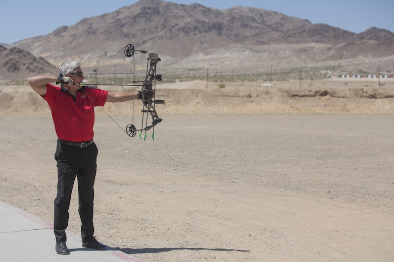 Creg McDonald, liaison to Marine Air Ground Task Force Training Command, Joint Improvised Threat Defeat Organization, fires the ceremonial first shot at the opening of the archery range on Range 3A at the installation rifle range aboard Marine Corps Air Ground Combat Center, Twentynine Palms, Calif., May 11, 2017. The idea was proposed through the installation’s newly-implemented Facebook group, Make the Stumps Better, which is an initiative proliferated by Combat Center Commanding General, Brig. Gen. William F. Mullen III, in order to solicit opinions and concerns from Combat Center patrons and determine actionable change from leadership. (U.S. Marine Corps photo by Cpl. Thomas Mudd)