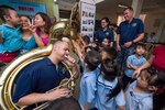 Musician 2nd Class James Brownell of the U.S. 7th Fleet Band plays the tuba for hearing impaired students to feel the sound vibrations with their hands during a community engagement at Tuong Lai Specialized School, May 10, 2017. Pacific Partnership is the largest annual multilateral humanitarian assistance and disaster relief preparedness mission conducted in the Indo-Asia-Pacific and aims to enhance regional coordination in such as medical readiness and preparedness for manmade and natural disasters.