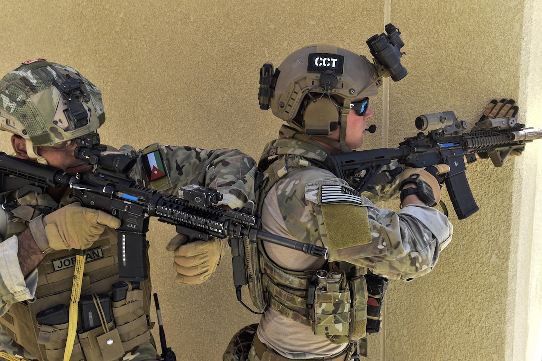 A special tactics airman assigned to the 23rd Special Tactics Squadron and Jordanian Armed Forces Special Task Force member participate in a personnel rescue mission during exercise Eager Lion 17 at King Abdullah II Special Operations Training Center in Amman, Jordan, May 11, 2017. Air Force photo by Senior Airman Ryan Conroy