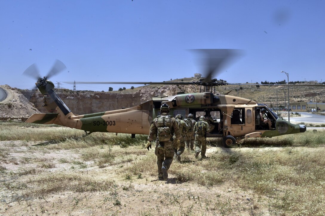 Air Force special tactics airmen assigned to the 24th Special Operations Wing, members of the Jordanian Armed Forces Special Task Force, and Italian special operations forces board a Royal Jordanian Air Force UH-60 L Black Hawk helicopter for extraction training during exercise Eager Lion 17 at King Abdullah II Special Operations Training Center in Amman, Jordan, May 11, 2017. Air Force photo by Senior Airman Ryan Conroy