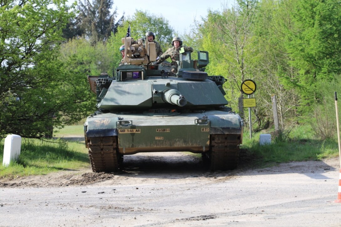 A Danish tank crew member, left, and U.S. Army Spc. Alexander Kefford, a tank loader for Battle Company, 1st Battalion, 66th Armor Regiment, 3rd Armored Brigade Combat Team, 4th Infantry Division, conduct maneuvering and armor recognition during the Nordic Tank Challenge hosted by the Danish 1st Armored Battalion, Jutland Dragoons Regiment, at Holstebro Barracks, Dragonkasernen, Denmark, May 15, 2017. The U.S. team's two tank crews have used the competition as a chance to build camaraderie with participating crews from Canada, Denmark, Germany, Norway and Sweden. Army photo by Staff Sgt. Ange Desinor
