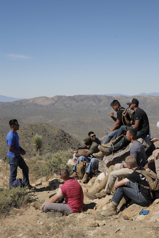 Sgt. Gonzalo Torres, instructor, Marine Corps Communication-Electronics School, speaks with a group Marines in the Round Table Mentorship Program on top of Ryan Mountain in Joshua Tree National Park, Calif. May 12, 2017. Round Table is a mentorship program created by MCCES to break down walls between leadership and junior Marines by encouraging open dialogue and develop professional relationships across the ranks. (U.S. Marine Corps photo by Cpl. Dave Flores)